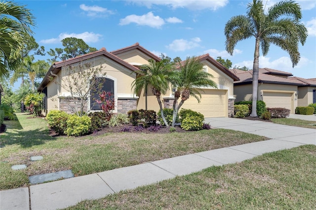 view of front of property with stucco siding, stone siding, an attached garage, and a front lawn