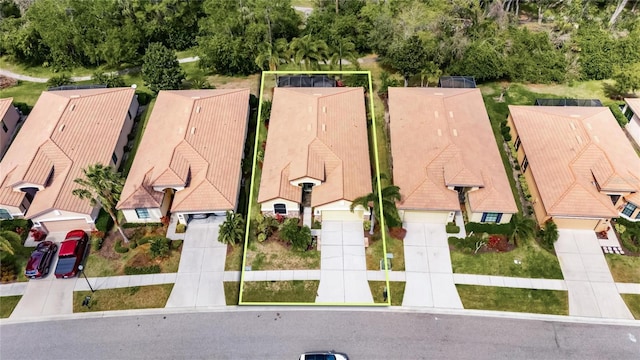 birds eye view of property with a residential view