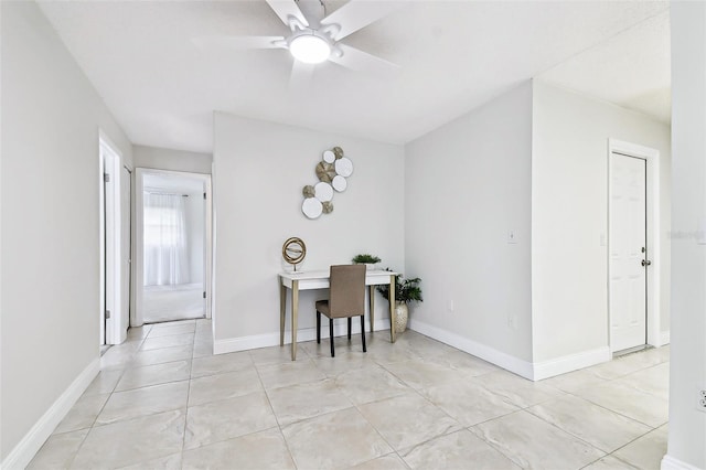 dining room with light tile patterned floors, baseboards, and a ceiling fan