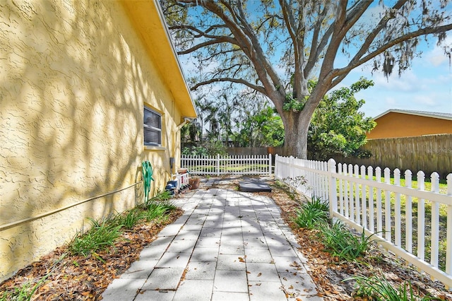 view of patio / terrace featuring fence