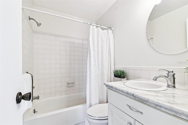 bathroom with toilet, vanity, and shower / bath combo