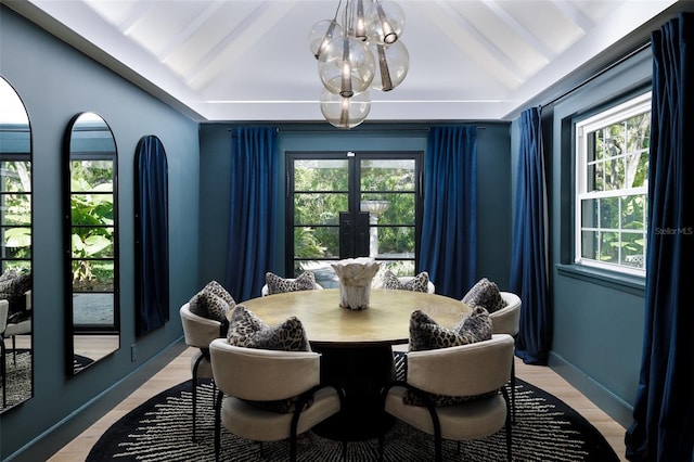 dining space featuring a healthy amount of sunlight, french doors, lofted ceiling with beams, and baseboards