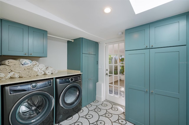 clothes washing area featuring light tile patterned floors, cabinet space, recessed lighting, and washer and clothes dryer