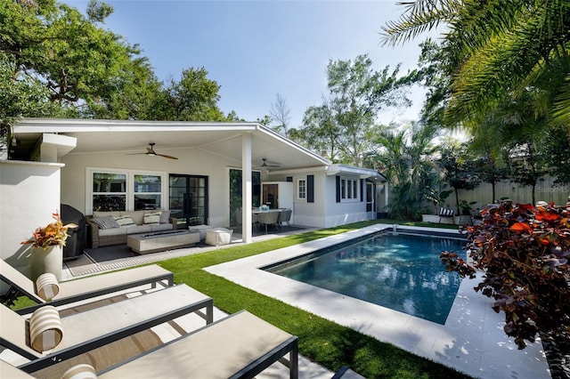 exterior space featuring an outdoor living space, a fenced in pool, ceiling fan, a grill, and a patio