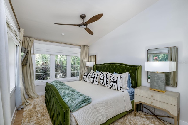 bedroom with a ceiling fan and vaulted ceiling
