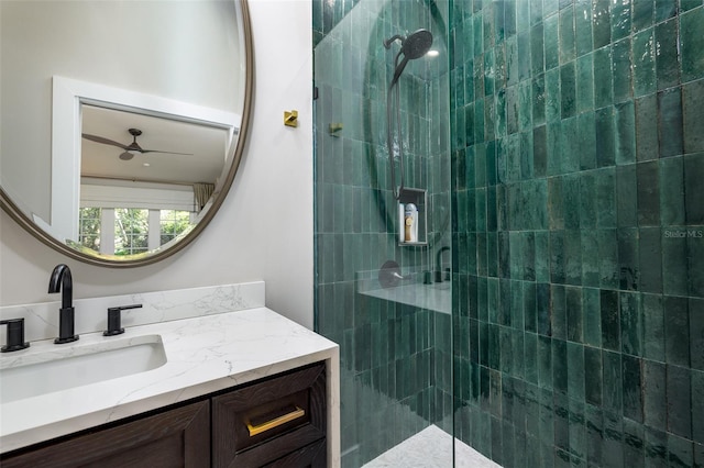 full bathroom featuring a walk in shower, vanity, and ceiling fan
