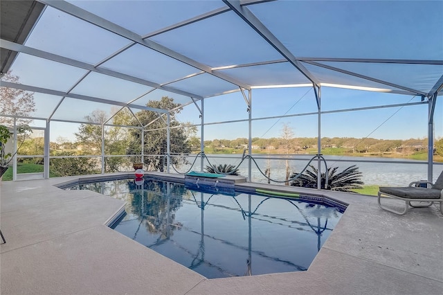 pool featuring a patio area and glass enclosure