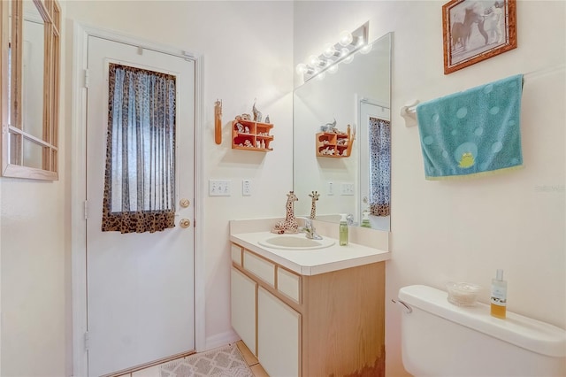 bathroom with vanity and toilet