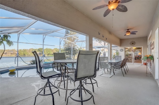 sunroom featuring ceiling fan