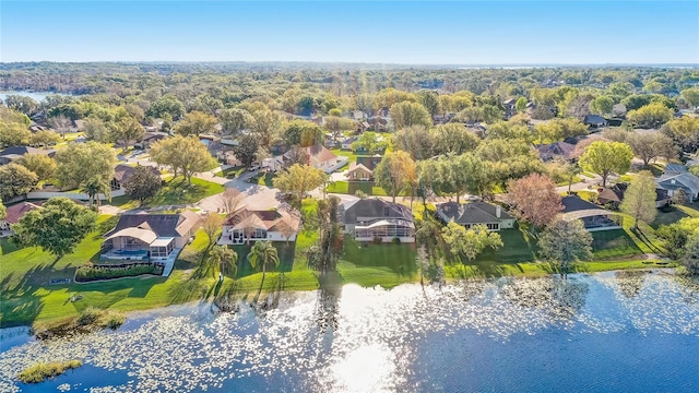 drone / aerial view featuring a residential view and a water view