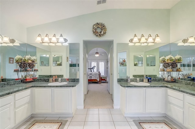 10837 Versailles Blvd, Clermont, FL 34711 - ensuite bathroom featuring lofted ceiling, tile patterned flooring, two vanities, and ceiling fan