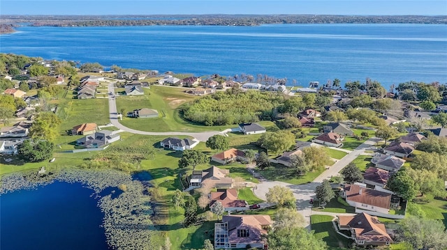 10837 Versailles Blvd, Clermont, FL 34711 - aerial view of property's location with a large body of water and nearby suburban area