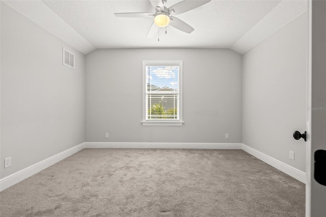 445 29th Ave N, Saint Petersburg, FL 33704 - unfurnished room featuring vaulted ceiling, carpet flooring, a ceiling fan, baseboards, and a textured ceiling