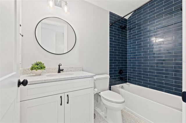 445 29th Ave N, Saint Petersburg, FL 33704 - full bathroom featuring vanity, toilet,  shower combination, tile patterned floors, and a textured ceiling