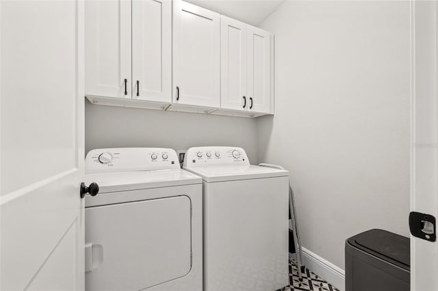 445 29th Ave N, Saint Petersburg, FL 33704 - laundry room with washer and clothes dryer, cabinet space, and baseboards