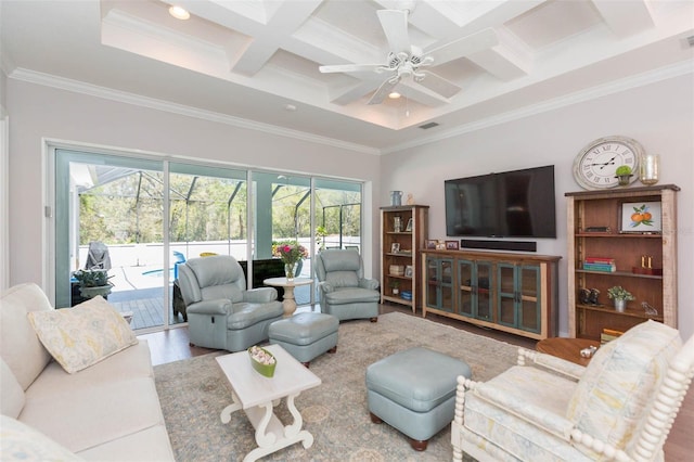 living room featuring visible vents, coffered ceiling, crown molding, and a ceiling fan