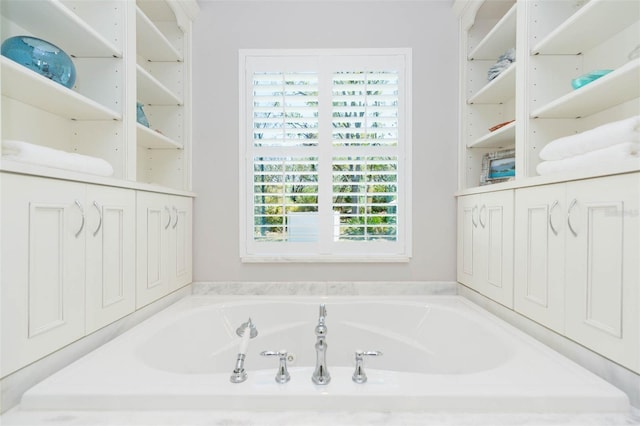 bathroom with a garden tub