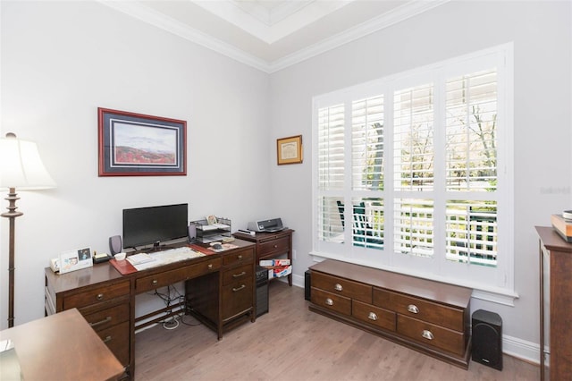 office area featuring baseboards, crown molding, and light wood finished floors