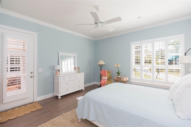 bedroom with crown molding, multiple windows, and wood finished floors