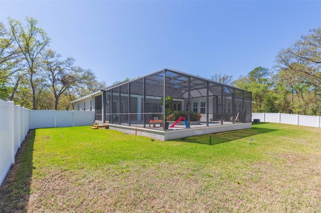 view of yard with a lanai, a fenced in pool, and a fenced backyard