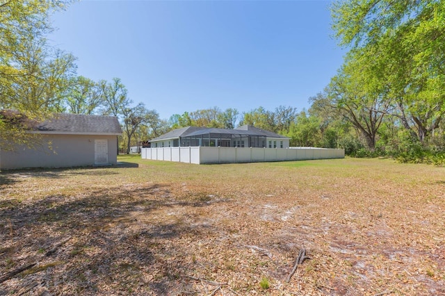 view of yard with a sunroom