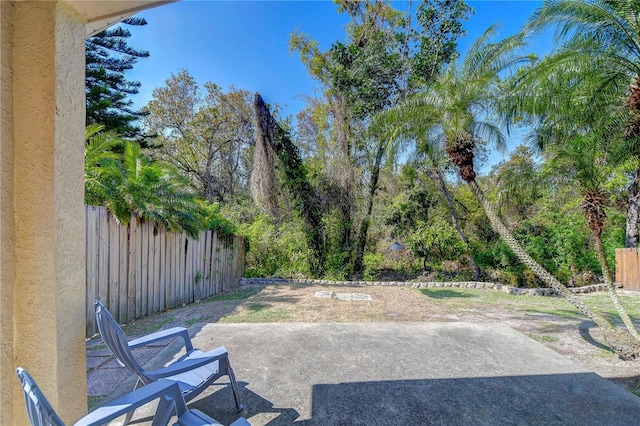 view of patio featuring fence