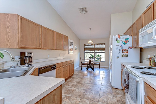 kitchen featuring white appliances, light tile patterned floors, visible vents, a sink, and light countertops