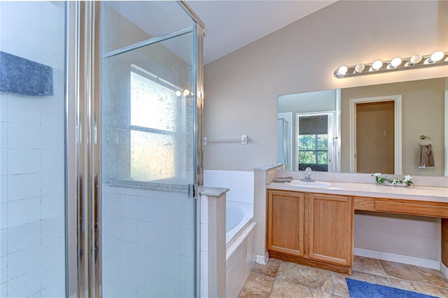 full bath with a bath, a shower stall, vanity, and vaulted ceiling