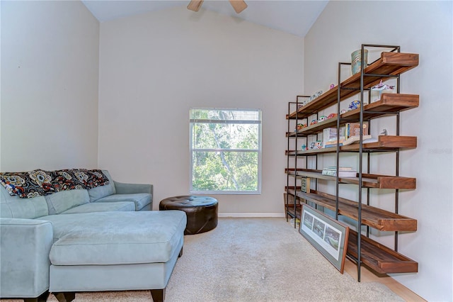 sitting room featuring carpet flooring, ceiling fan, baseboards, and lofted ceiling