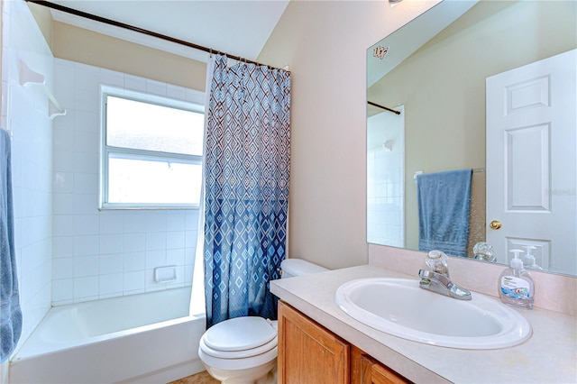 full bath featuring vanity, toilet, and shower / bath combo