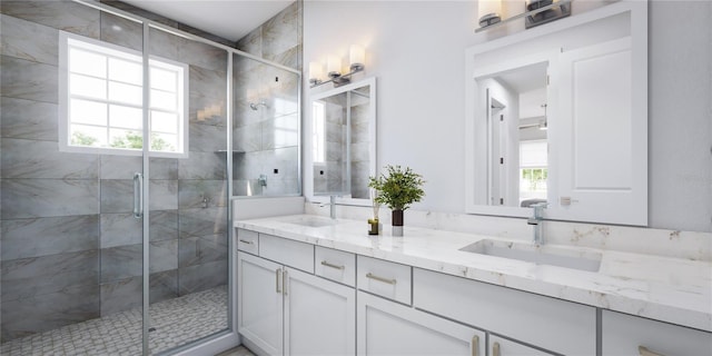 bathroom featuring a sink, plenty of natural light, and a shower stall