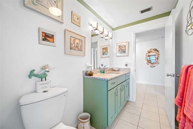 bathroom with visible vents, baseboards, toilet, tile patterned floors, and vanity