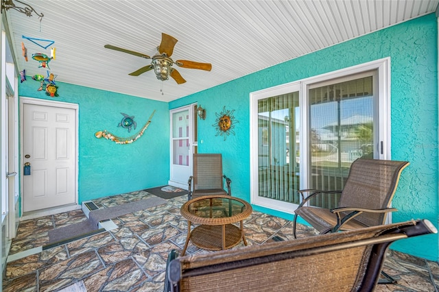 view of patio featuring ceiling fan