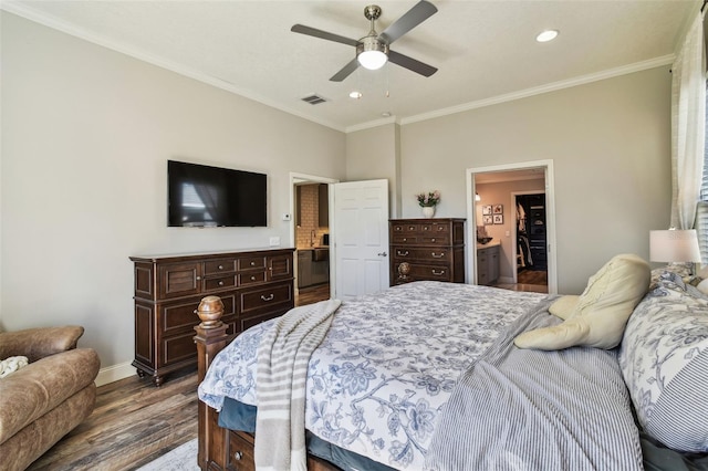 bedroom featuring visible vents, wood finished floors, recessed lighting, crown molding, and baseboards