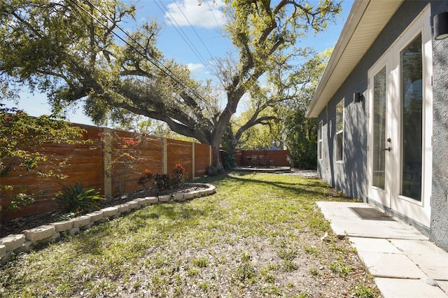 view of yard with a fenced backyard