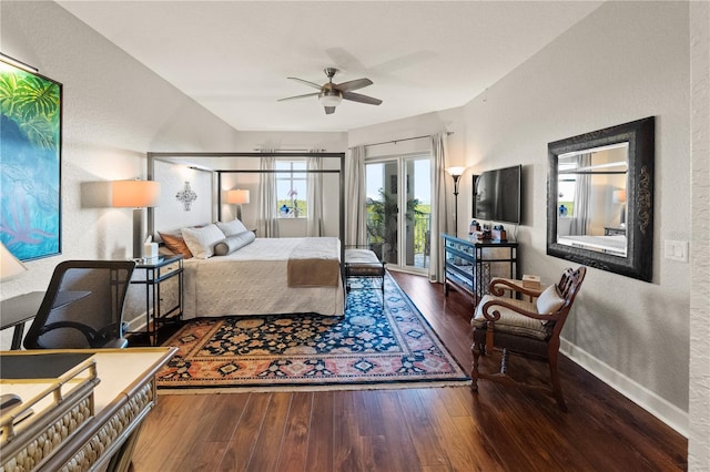 bedroom with access to outside, hardwood / wood-style floors, baseboards, ceiling fan, and a textured wall