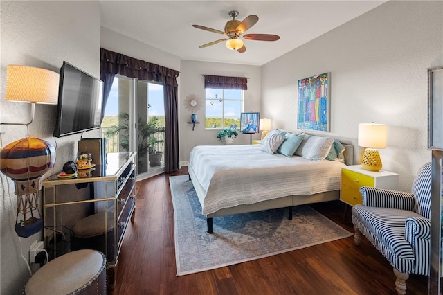 bedroom featuring baseboards, ceiling fan, and wood finished floors