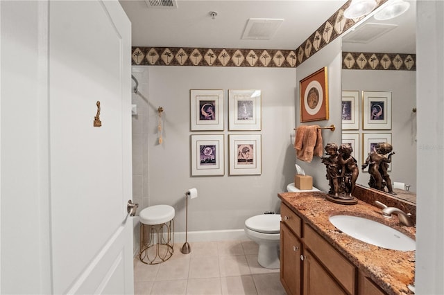 full bathroom with baseboards, toilet, tiled shower, tile patterned floors, and vanity