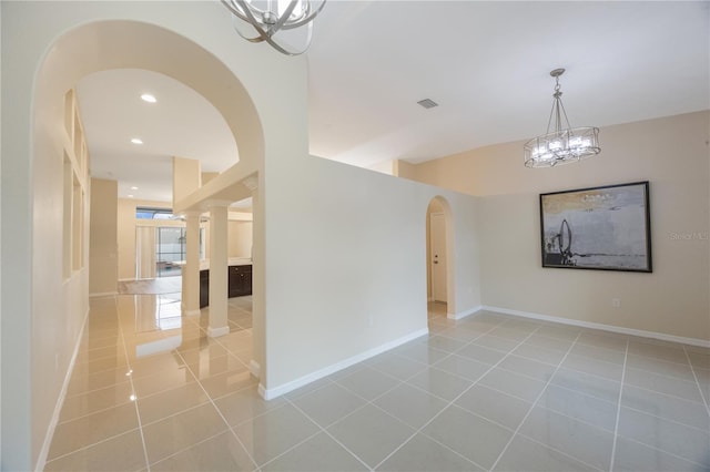 empty room with recessed lighting, light tile patterned floors, baseboards, and visible vents