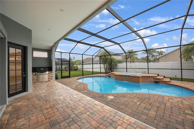 view of pool featuring exterior kitchen, a jacuzzi, a patio area, and fence private yard