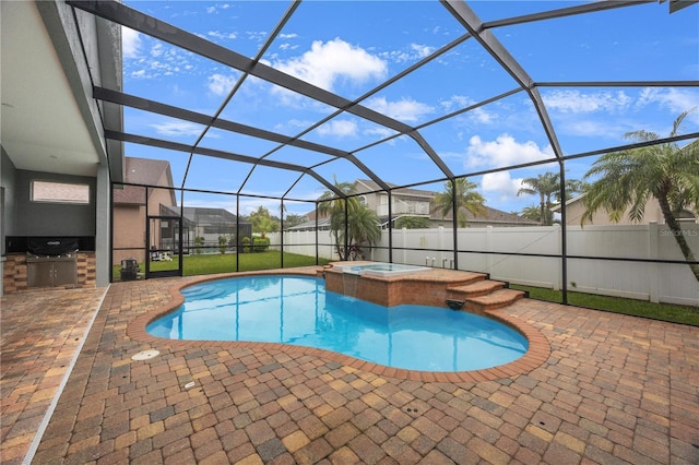 view of pool with a patio, area for grilling, fence, and a lanai