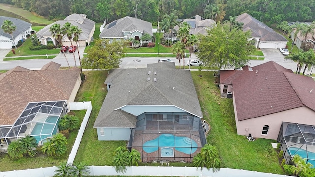 birds eye view of property with a residential view