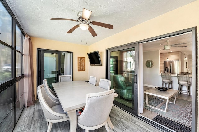 sunroom with a ceiling fan