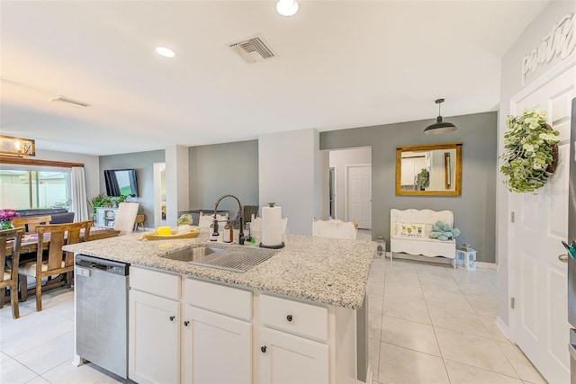 kitchen with light tile patterned floors, visible vents, white cabinetry, a sink, and dishwasher