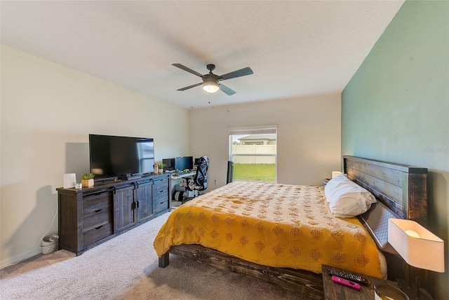 bedroom featuring a ceiling fan and carpet