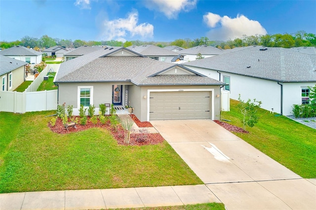 ranch-style home featuring a front lawn, a garage, a residential view, and a shingled roof