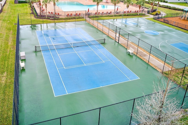 view of sport court with fence