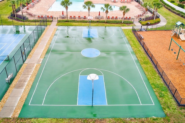 view of basketball court featuring community basketball court and fence