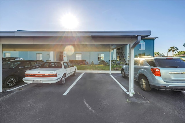 view of partially covered parking lot