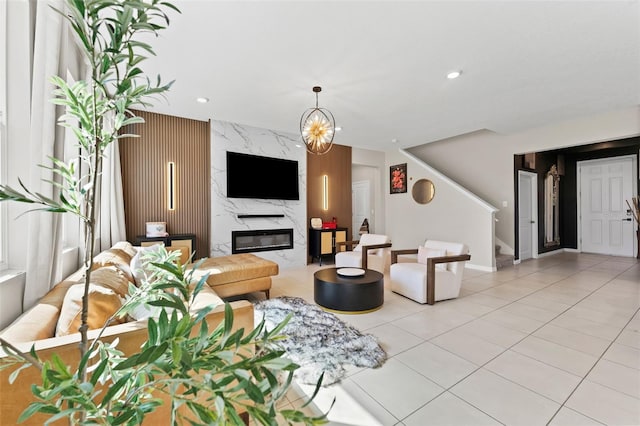 living room featuring stairway, light tile patterned floors, recessed lighting, and a high end fireplace